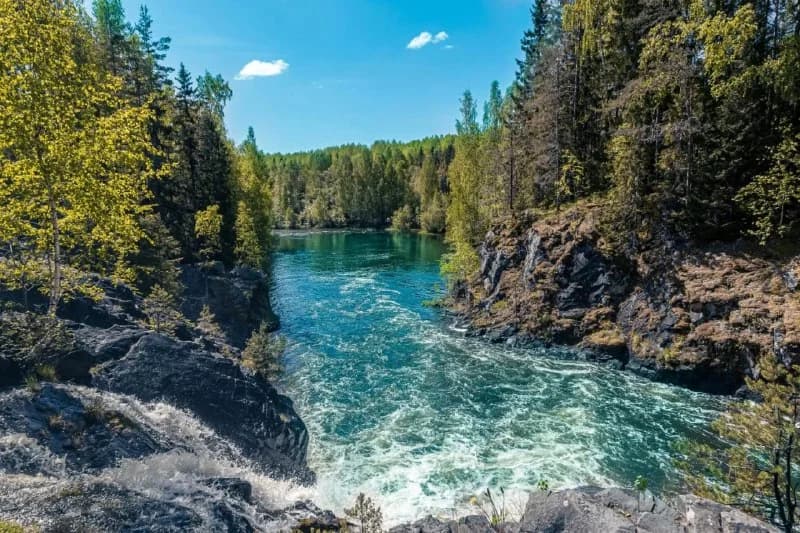 Turquoise water flowing between rocky canyon walls